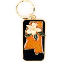 Brass White Lily Key Chain On Orange Background