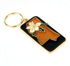 Brass White Lily Key Chain On Orange Background