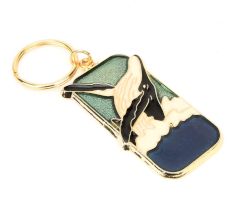 Dolphin On Brass Key Chain With Green Color In The Background