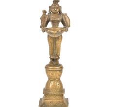 Brass Lady Holding A Diya In Her Hand And Is On A Raised Platform