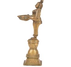 Brass Lady Holding A Diya In Her Hand And Is On A Raised Platform