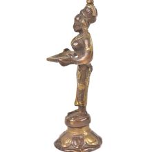 Bronze Lady Holding A Diya In Her Hand Is On A Raised Platform