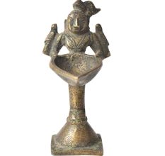 Brass Lady Holding A Diya In Her Hand On A Raised Platform