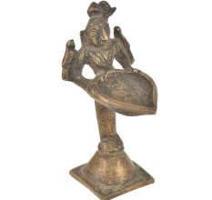 Brass Lady Holding A Diya In Her Hand On A Raised Platform