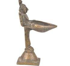 Brass Lady Holding A Diya In Her Hand On A Raised Platform