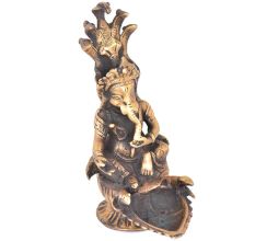 Brass Ganesha Sitting With Sheshnag And Diya