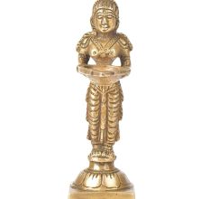 Brass Lady Standing On A Raised Platform Holding A Diya