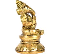 Brass Ganesha Sitting On A Raised Platform