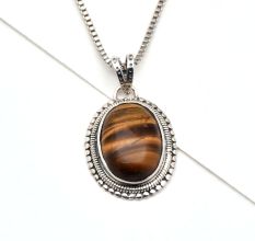 92.5 Sterling Silver Pendant Studded With Big Oval Tiger Eye Stone Decorative Border