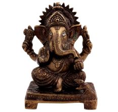 Brass Ganesha Statue Sitting On A Chowki