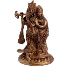 Brass Radhakrishna Statue With Fine Detailing And Peacock