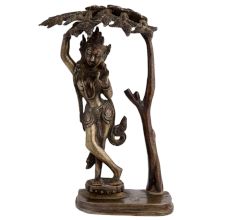 Brass Goddess Statue Under A Tree
