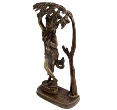 Brass Goddess Statue Under A Tree