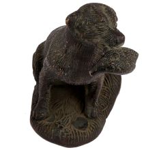 Brass Sitting Dog Statue Holding Flesh Of A Animal