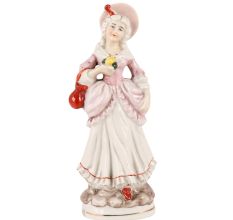 Porcelain Figurine Of A Lady Standing In Pink Dress
