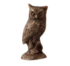 Brass Owl  Statue Perched On Top Of A Wooden Branch