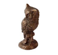 Brass Owl  Statue Perched On Top Of A Wooden Branch