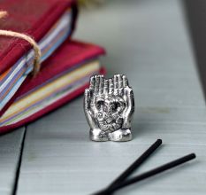 Brass Lord Ganesha Sitting On Hand Statue In Silver Finish 