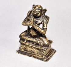 Male God Figure Sitting with Axe