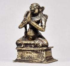 Male God Figure Sitting with Axe