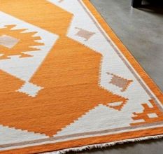 Hand Knotted Orange And Ivory Rug