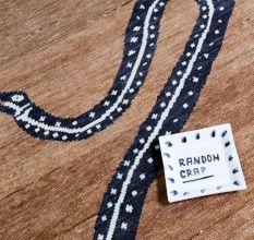 Serpentine Border Wool Rug