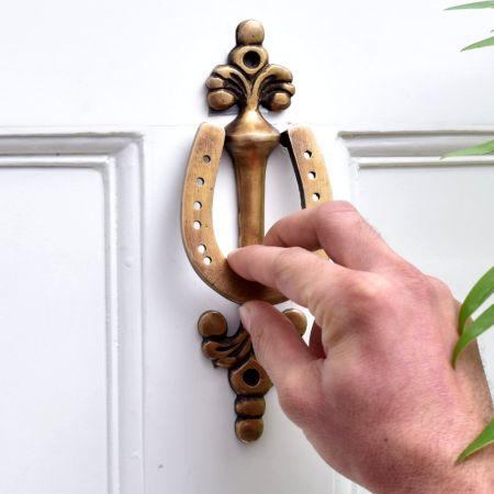 Brass Horse Shoe Door knocker On Long Base Plate