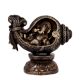 Brass Ganesha Sitting in a Conch In Black Finish